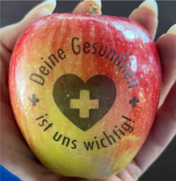 Apfel mit Schrift: Deine Gesundheit ist uns wichtig