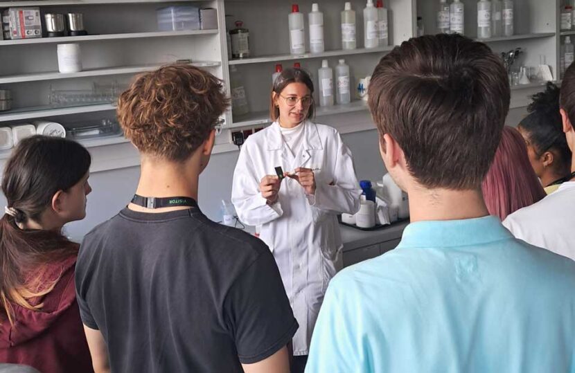 Marie from Technical Customer Service explains laboratory experiments and procedures to the students on the advanced chemistry course.